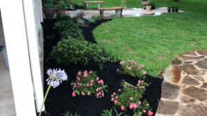 Professional landscape installation and lush green lawn at a Bryan or College Station, TX property by C&C Lawn & Irrigation